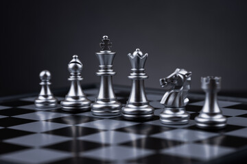 white chess pieces arranged on a chessboard, creating a visually appealing and strategic composition