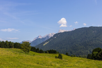 summer mountain landscape with grin hills and clear sky with copy space 