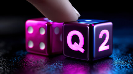 Symbol for the 2nd Quarter of the year. Hand turns dice and changes the expression Q1 to Q2. A hand manipulates a cube altering a numerical indicator from one to two signifying
