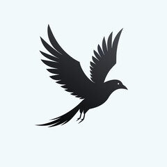 Elegant silhouette of a black bird in mid flight with wings spread wide against a clean white background