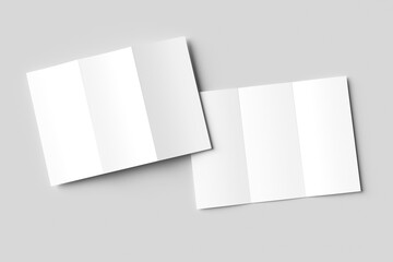 Two blank white tri-fold brochure mockups, slightly overlapping on a light gray background. One is...