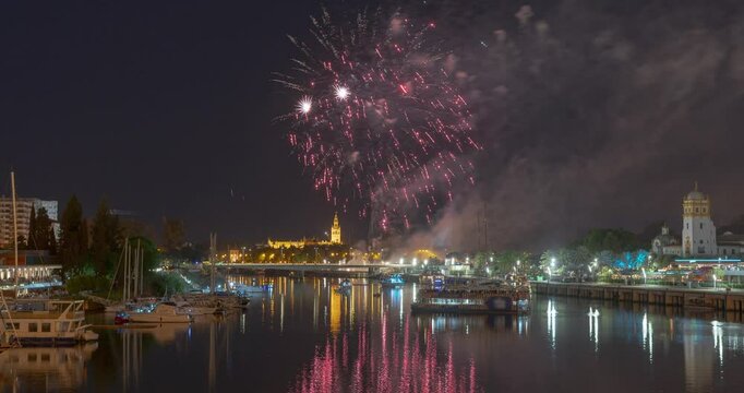 Timelapse of Fireworks Finale over Seville Skyline with Giralda and San Telmo Palace