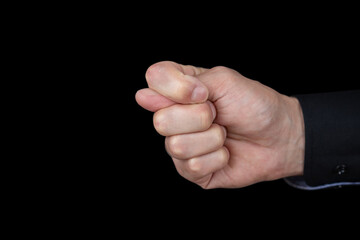 The human hand gesture Fig closeup on dark background