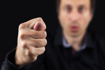 The man show gesture Fig closeup on blurred background