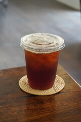 Americano coffee on wooden table.
