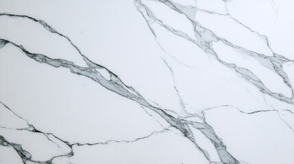 Statuario marble slab with gentle grey veins and smooth white background surface