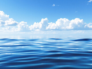 Fototapeta premium Clear blue ocean water with a bright sky and clouds reflecting on the surface.