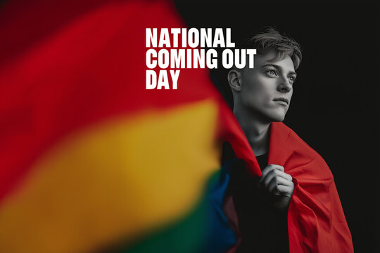 Man holding rainbow flag. National Coming Out Day.