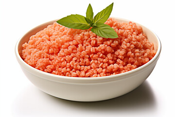 uncooked red lentils in white ceramic bowl with fresh mint garnish on top