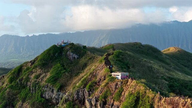 Tourists hiking the Lanikai Pillbox Trail on Kaiwa Ridge, Oahu, aerial flyover