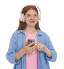 Beautiful teenage girl in headphones using smartphone on white background