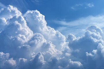 Fluffy cumulus clouds against a vibrant blue sky