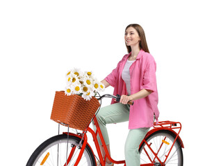 Smiling woman riding bicycle with basket of flowers against white background