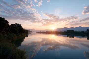 Obraz premium Tranquil sunrise over serene lake with majestic mountain reflections
