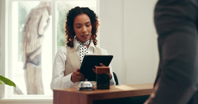 Front desk, tablet and hotel receptionist with man for accommodation, booking help and business trip. Conversation, tech and concierge with guest for hospitality, service or corporate travel check in