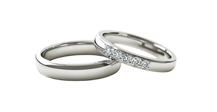 Two elegant wedding bands, smooth and simple, with small diamonds set along the band