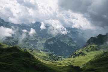 Fototapeta premium Alpine valley shrouded in clouds, sun-drenched meadows