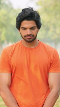 Vertical Shot of Young Indian Man Feeling Guilty