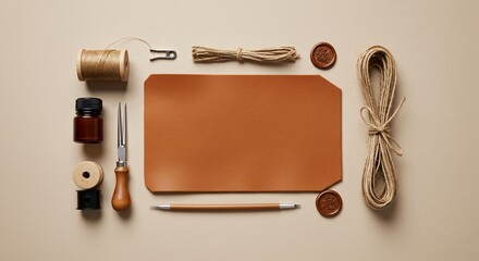 Leather crafting tools arranged on a beige surface showcasing hobby and artistry