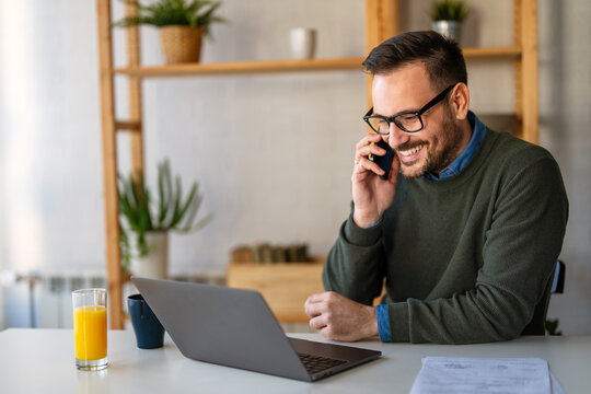 Young male employee, business man working in the office or remote work at home