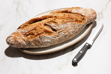 Artisan buckwheat bread bar isolated on kitchen countertop