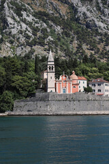 beautiful panoramic view of medieval church from water in boka kotorska bay. cruise on adriatic sea. montenegro
