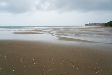 Long Bay Beach in the Rain, Moody Coastal Scene
