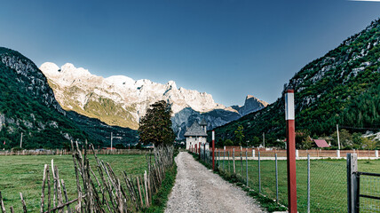 Mountains and church in theth albania sunrise in the morning 