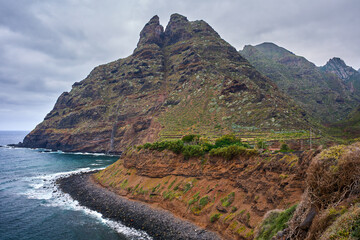 Roque Dos Hermanos above rocky beach