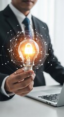 Businessman holding lightbulb with padlock icon for security and innovation