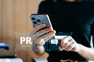 PR, Public relations concept. hands using laptop and tablet with public relations icon for...