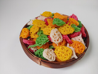 Kerupuk bunga or kerupuk mawar or flower cracker or rose cracker are typically deep-fried until...