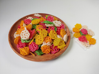 Kerupuk bunga or kerupuk mawar or flower cracker or rose cracker are typically deep-fried until...