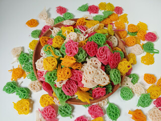 Kerupuk bunga or kerupuk mawar or flower cracker or rose cracker are typically deep-fried until...