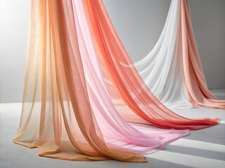 Elegant display of sheer fabrics in gradient colors cascading gracefully with soft light and shadows creating a serene atmosphere