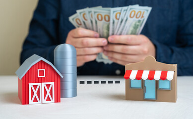 A man calculates the profit from a farm and shop partnership. Profits from the sale and marketing...