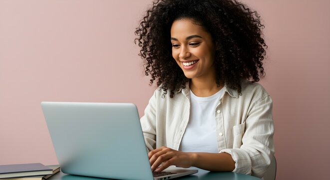Happy young woman working at home on laptop. Remote business occupation and online education. Digital workplace concept.