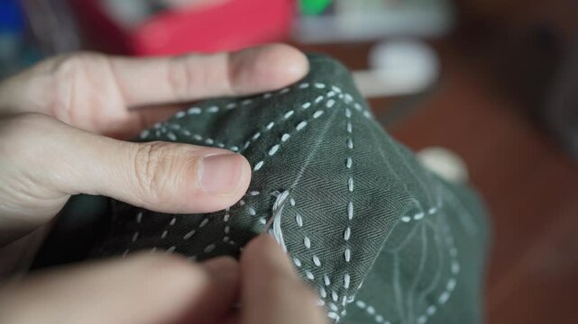 Mending clothes with Sashiko, a traditional Japanese embroidery and stitching technique