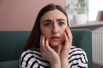 Worried woman suffering from paranoia at home