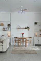 Stylish dining table with chairs in room. Interior design