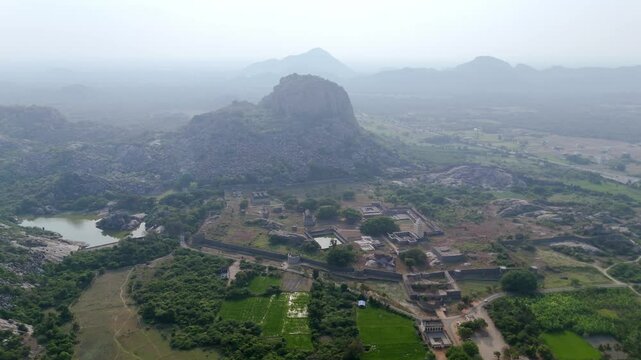 Timeless fort hill surrounded by historical structures and forested plains near Gingee.