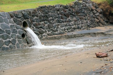 Water Emerging from Sewage Pipe During Stormy Weather