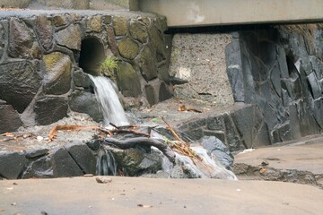 Water Emerging from Sewage Pipe During Stormy Weather