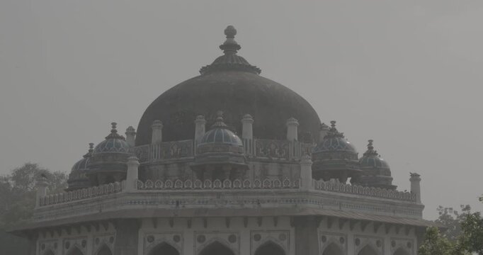 New Delhi, Delhi, India. Doves birds sitting on Isa Khan's Tomb near The Humayun's tomb. Famous place is Tomb of Mughal emperor, Mirza Nasir al-Din Muhammad commonly known as Humayun situated in Delhi