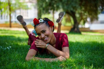 Beautiful young woman wearing flower crown, enjoying sunny day outdoors