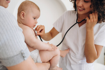 Mother with her baby girl is at doctor's appointment