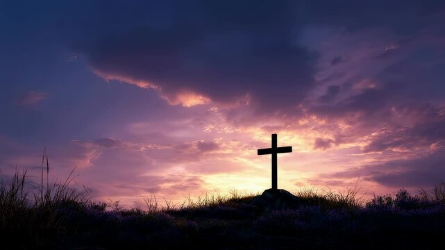 Silhouette of wooden christian cross standing on a hill at sunset with purple and orange clouds creating a dramatic and inspiring scene symbolizing faith, hope and resurrection