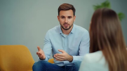 Professional therapist listening supportively as female client discussing personal struggles during confidential psychological counseling session focusing on mental wellness and emotional healing