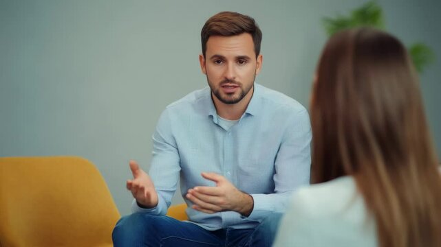 Professional therapist listening supportively as female client discussing personal struggles during confidential psychological counseling session focusing on mental wellness and emotional healing