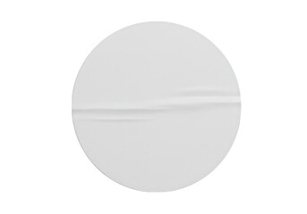 A single white round paper sticker with a subtle wrinkle, isolated on white, ideal for product labeling isolated on transparent background